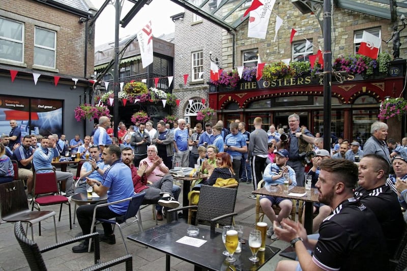 Omagh and Dublin fans watch the `Super 8&#39; clash between the old rivals in the Main Street area of Omagh at the weekend 