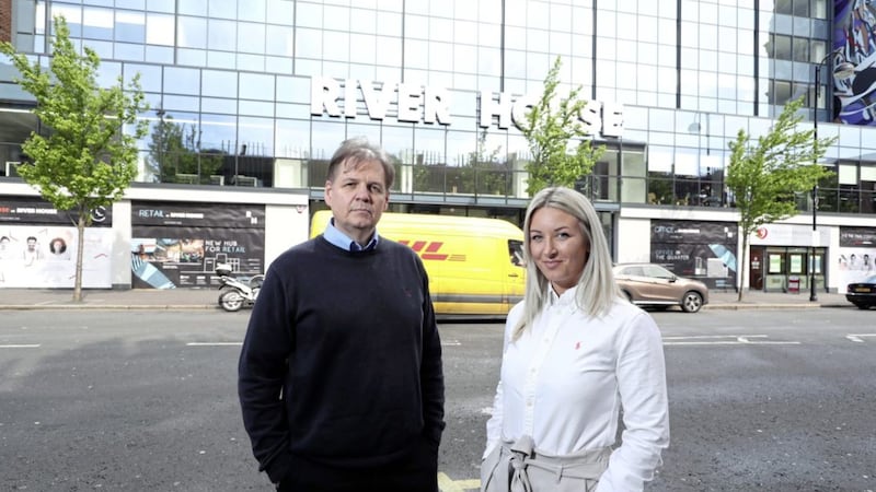 Pictured outside the new Zymplify Belfast office are CEO, Michael Carlin and sales executive, Becky Mercer 