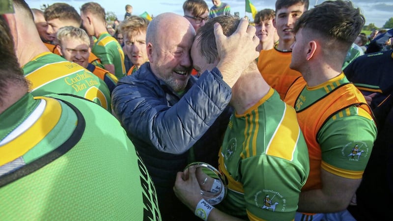 Dunloy stalwart Gary O&#39;Kane celebrates with club captain Paul Shiels after their 2021 Antrim final win over O&#39;Donovan Rossa - and the pair will hope to be celebrating again on Sunday after the Cuchullain&#39;s face Ballyhale Shamrocks in the All-Ireland decider. Picture by Mal McCann 