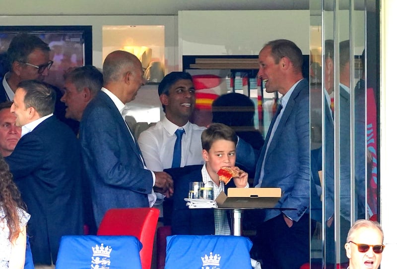 The Prince of Wales chatted to Prime Minister Rishi Sunak while Prince George enjoyed a slice of pizza at the cricket (PA)