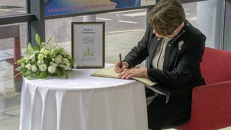 Arlene Foster signing the book of condolence at the Burnavon Arts Centre in Cookstown. Picture from BBC 