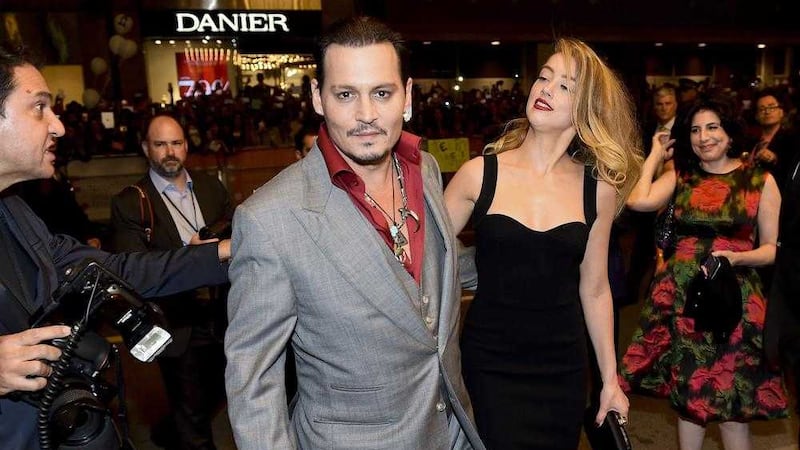 Actor Johnny Depp and ex-wife Amber Heard at the premiere of Black Mass at the Toronto International Film Festival. Picture by Nathan Denette/The Canadian Press
