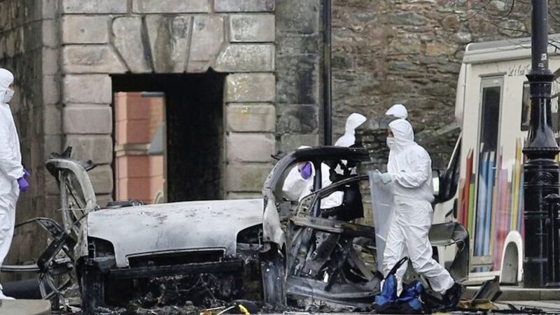 Forensics officers examined the remains of the car bomb that exploded outside Derry court house. Picture by Margaret McLaughlin 