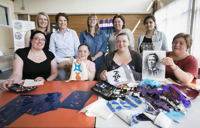 Women taking part in a banner making workshop in Belfast