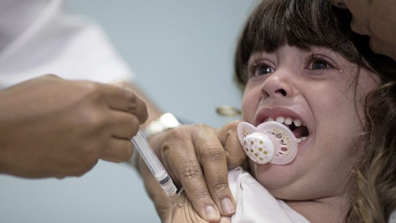 A child receives a measles vaccination. The number of measles cases in Europe jumped sharply during the first half of this year 