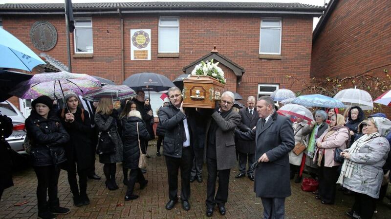 The funeral of popular west Belfast priest Fr Des Wilson leaves his home in Springhill Close surrounded by friends and family. Picture by Mal McCann. 