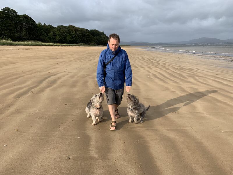Geoff Maskell walking his dogs on Rathmullan beach, Donegal