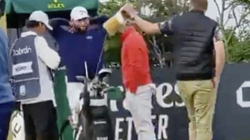 Co Down golfer Rory McIlroy's second round at the Scottish Open got off to an unusual start after a spectator took a club from his bag on the 10th tee