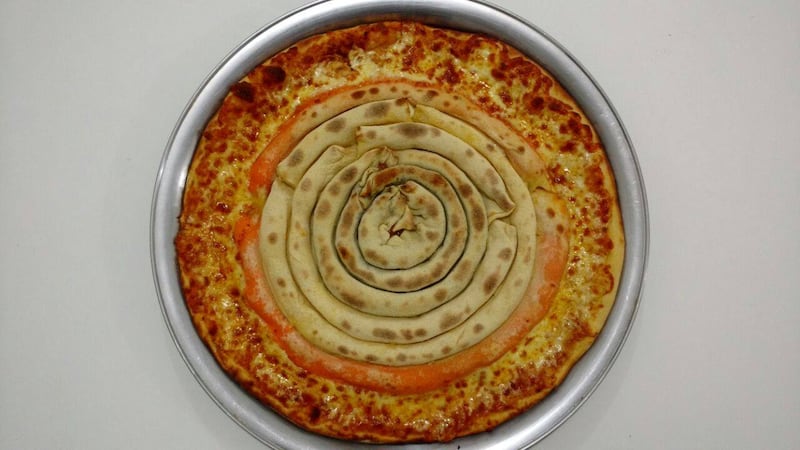 This pizza has crust in the middle and it’s making us feel all sorts of weird