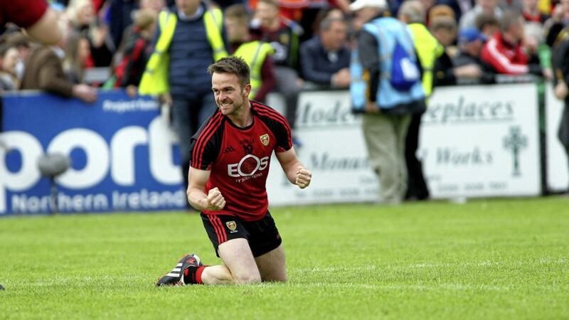 Mark Poland celebrates after last summer&#39;s Championship win over Armagh. Although now retired from the inter-county scene, he will be hoping to see Down back on the winning trail this weekend. Picture by Seamus Loughran 