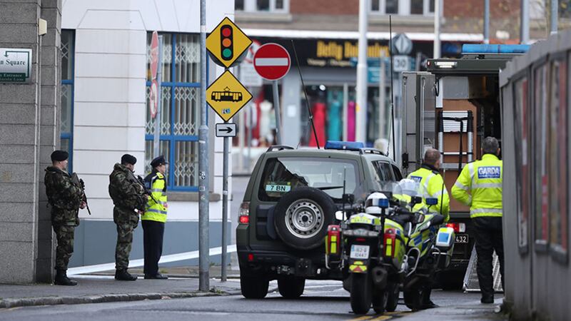 Soldiers by a bomb disposal unit vehicle outside the family court building at Phoenix House, in the Smithfield area of Dublin, which has been evacuated after a suspect device was found&nbsp;