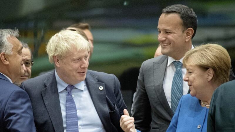 Prime Minister Boris Johnson with Taoiseach Leo Varadkar and Chancellor of Germany Angela Merkel at a round table for the European Council summit at EU headquarters in Brussels. Picture by Stefan Rousseau/PA Wire 