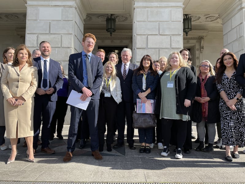 Leader of the Opposition Matthew O’Toole, centre, with members of his SDLP party and anti-poverty and children’s lobby groups outside Parliament Buildings