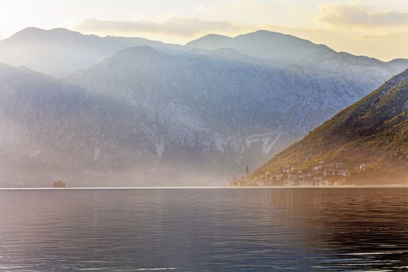 Mountains sweep down to the sea in the Bay of Kotor in Montenegro 