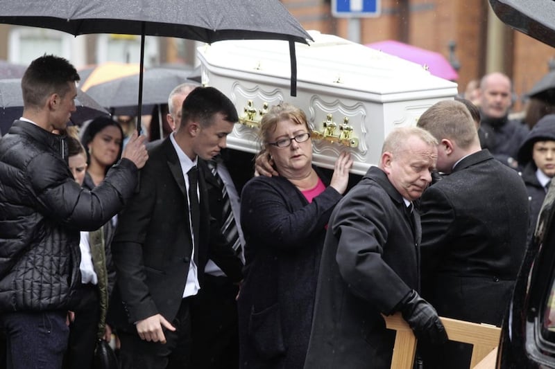 Carol Corr carries her daughter, Joleen&#39;s coffin in west Belfast yesterday. Picture Matt Bohill. 