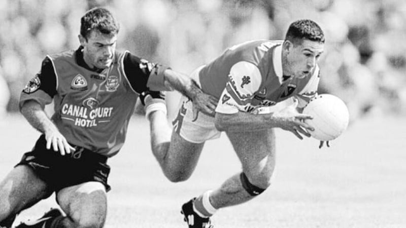 CHASING SHADOWS...Armagh attacker Diarmaid Marsden leaves Down&rsquo;s Finbar Caulfield trailing in his wake during yesterday&rsquo;s Ulster Senior Football Championship final at Clones, Sunday August 1 1999. 