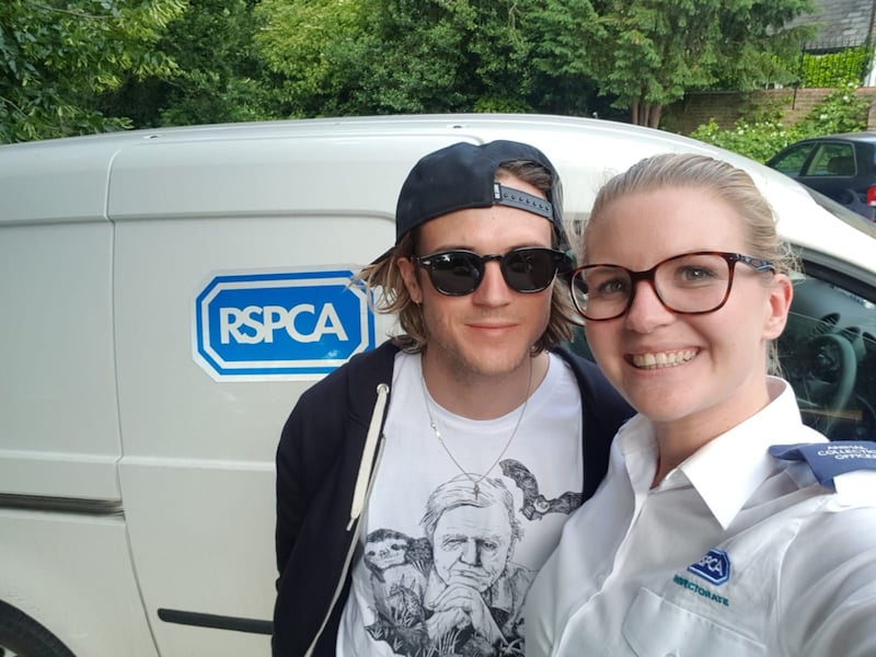 McFly bassist Dougie Poynter with Animal Collection Officer Miller. 