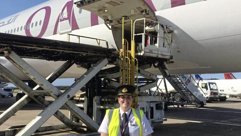 Ballycastle woman Pamela Forsythe alongside the Qatar Airlines Boeing 777 which brought 400 international students to Queen&#39;s University 