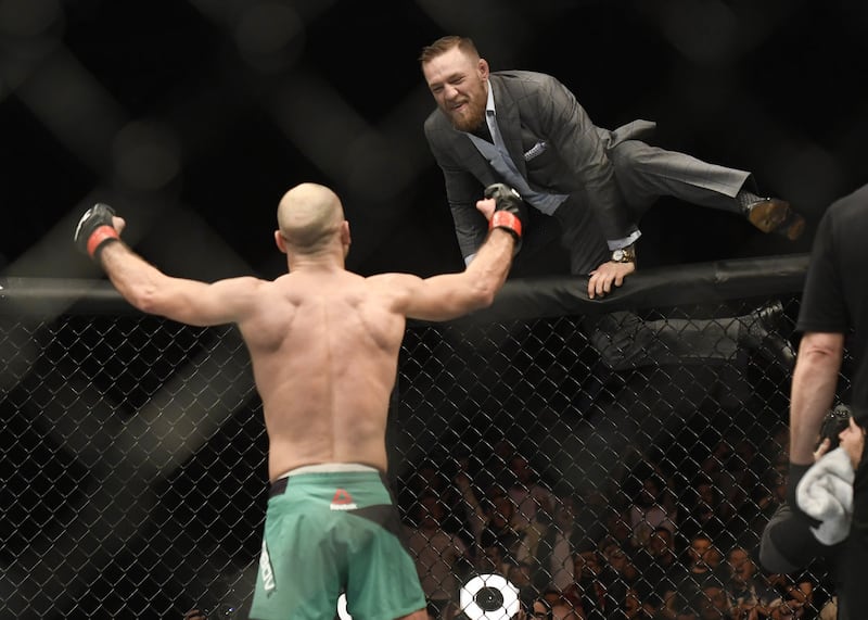 Conor McGregor climbs into the octagon to congratulate Artem Lobov <br />Picture by Pacemaker &nbsp;