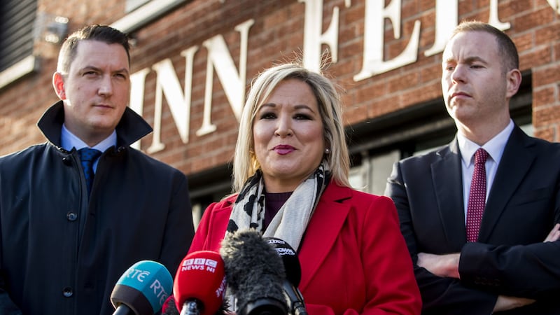 Sinn F&eacute;in Vice President Michelle O'Neill with party colleagues John Finucane (left) and Chris Hazzard (right) speaking with media outside the party's headquarters in Belfast about the prospects of an upcoming election in December &nbsp;