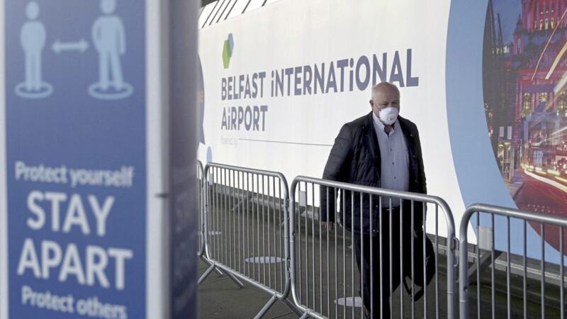 A passenger arrives at Belfast International Airport for the first passenger flights to leave the airport since the coronavirus lockdown. Picture by Hugh Russell 