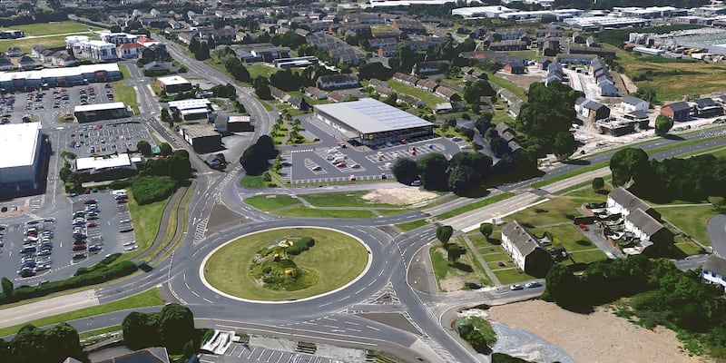 Aerial image of a new build Lidl supermarket next to a roundabout.