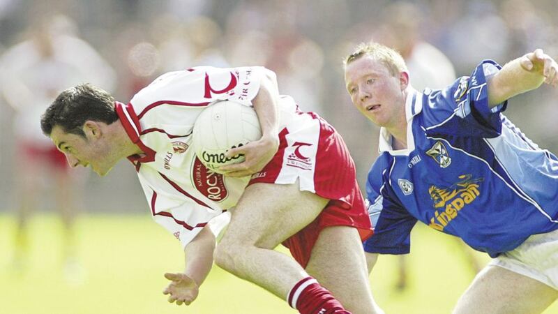 Tyrone's Davy Harte clears his lines under pressure from Cavan's Jason O'Reilly during the Ulster Championship semi-final in Clones on June 19 2005. Picture by Ann McManus&nbsp;