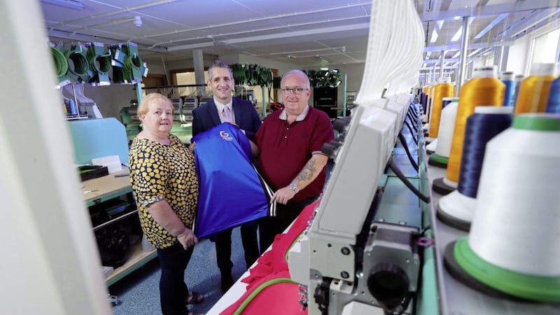 Gary Winter (right) with his wife Carol and Paul Reid, Ulster Bank at the new C&amp;G Embroidery premises 