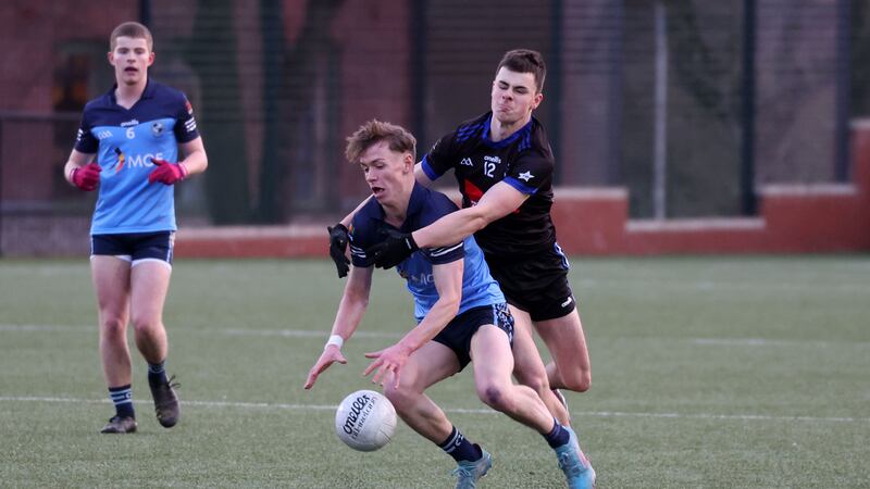 St. Patrick's Liam Blaney  and Rathmore’s Rory McErlean  during the MacLarnon Cup Semi Final game at Coláiste Feirste in Belfast.
PICTURE: COLM LENAGHAN