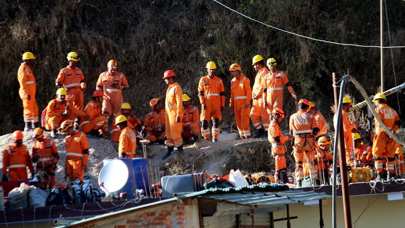Rescuers had been working by hand to remove debris (AP)
