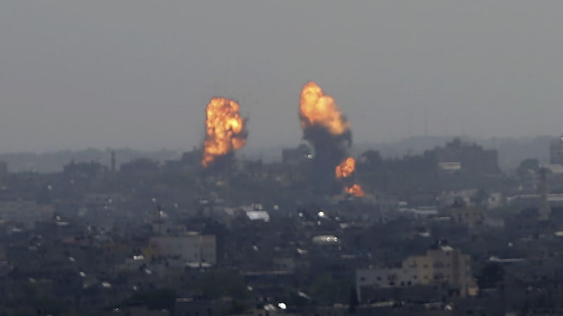 Flares rise after an Israeli forces strike in Gaza City, Tuesday, May 11, 2021 (AP Photo/Hatem Moussa)&nbsp;