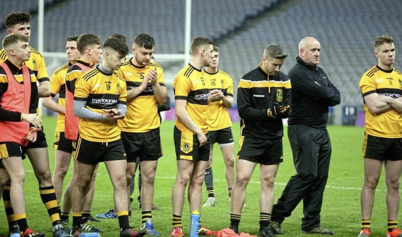 St Enda's manager Frank Fitzsimons with his team after the final whistle Picture by Seamus Loughran