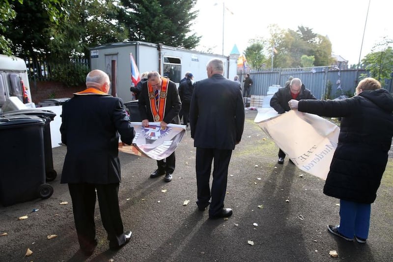 Loyalists and Oranage Order members dismantle the protest camp at Twaddle Picture:Mal McCann 