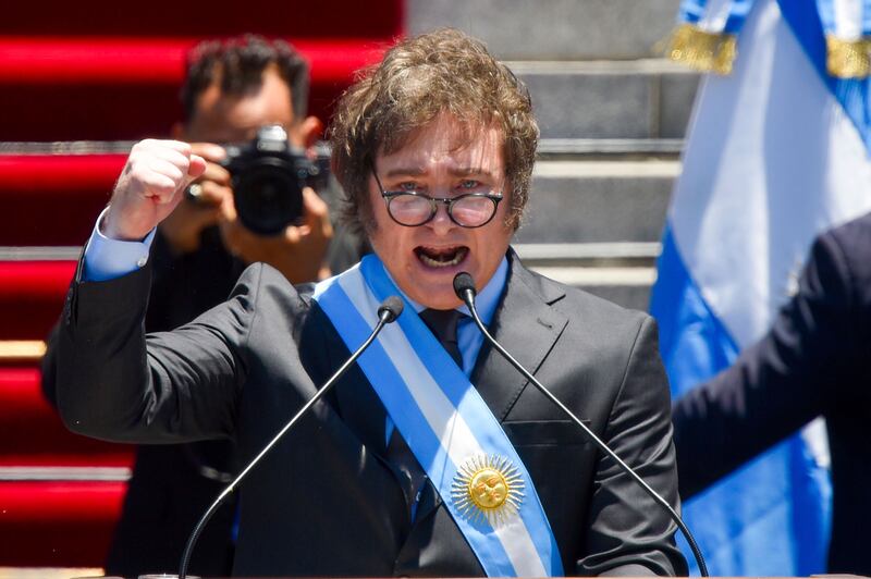 Argentina’s President Javier Milei speaks outside the Congress in Buenos Aires (AP)