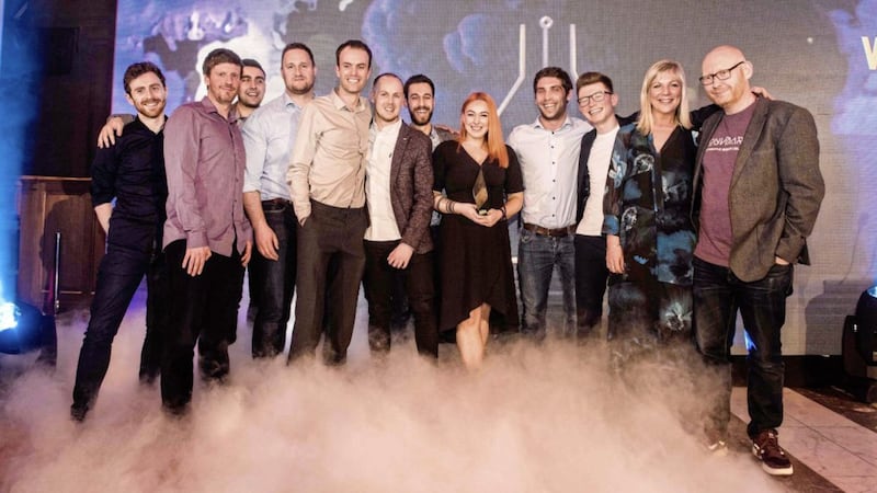 Whitespace collects the Company of the Year Award at the Digital DNA Awards. Suzanne Wylie, chief executive of Belfast City Council (second from right), presented the award to Glenn McClements, general manager of Whitespace (far right). 