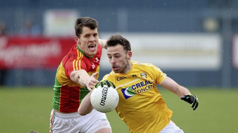 Carlow midfielder Brendan Murphy (left) hailed promotion as their &quot;All-Ireland&quot; after beating Antrim on Sunday - now Antrim hope they both beat Laois. Picture by Cliff Donaldson