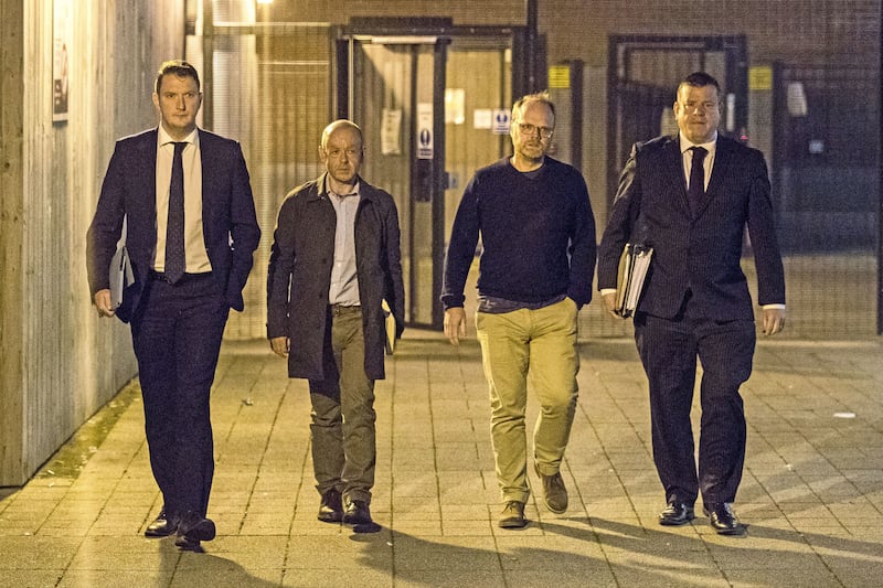From left, solicitor John Finucane with his client, investigative journalist Barry McCaffrey, and Trevor Birney with his solicitor Niall Murphy leaving Musgrave police station in Belfast on Friday night. Picture by&nbsp;Liam McBurney, Press Association