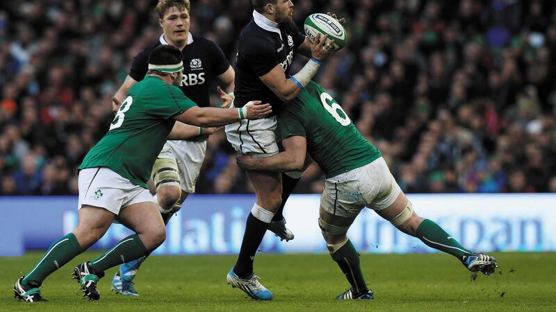 Ireland prop Marty Moore, pictured left during a 2014 clash with Scotland, could miss the Six Nations because of a torn hamstring