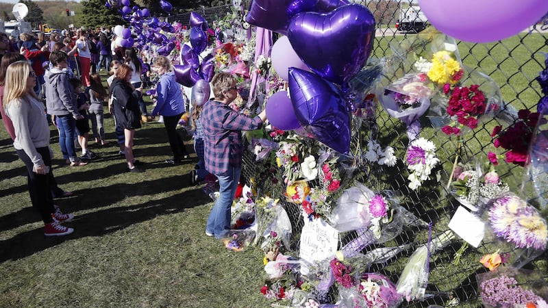 A memorial fence in memory of pop star Prince is lined with flowers and signs at Paisley Park Studios in Chanhassen. Picture by Associated Press&nbsp;