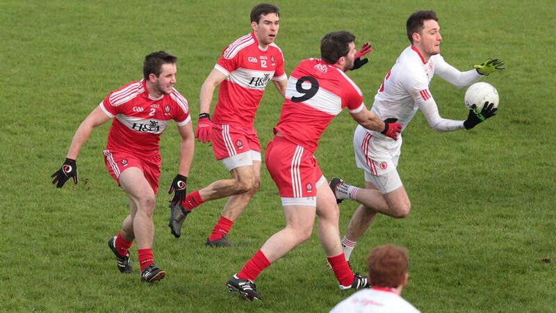 Derry's Ryan Ferris, Benny Heron and Mark Lynch with Patrick Quinn of Tyrone during Sunday's McKenna Cup match&nbsp;