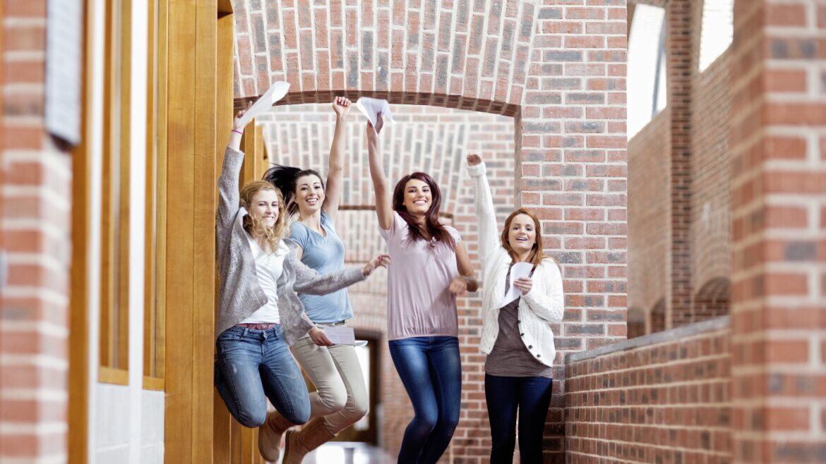 JUMPING FOR JOY: Students celebrate their exam results