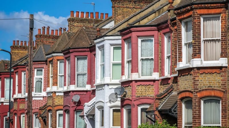 Photo of a row of British terraced houses on a sunny day