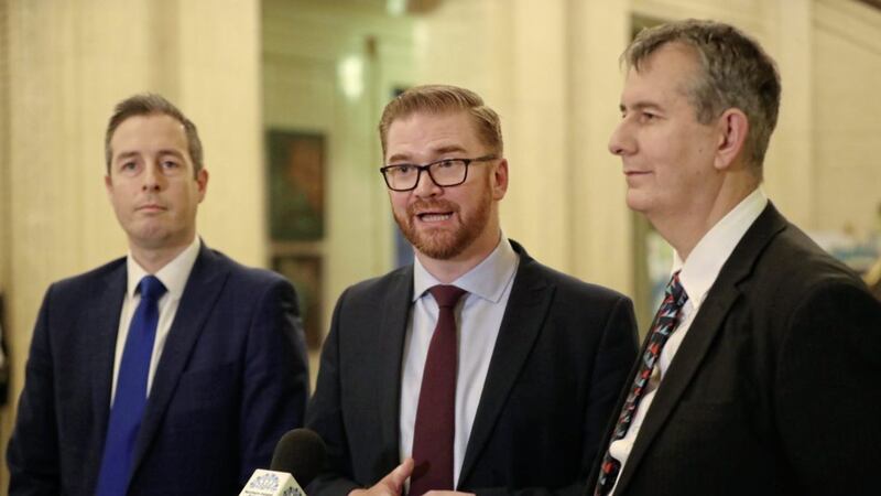 (left to right) DUP MLAs Paul Givan, Simon Hamilton and Edwin Poots speaking to the media at Parliament Buildings. Picture by Niall Carson, Press Association 