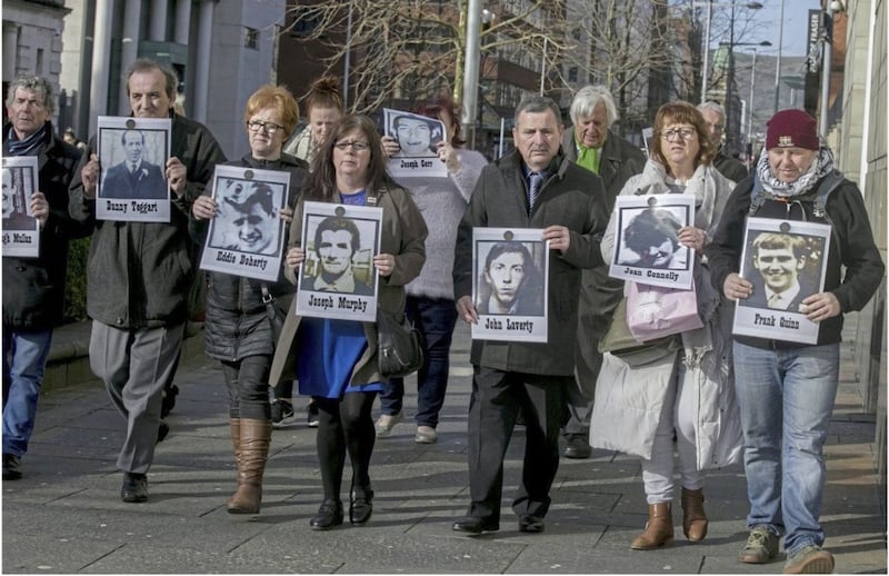 Families of the Ballymurphy victims with barrister Michael Mansfield QC outside the court in Belfast. Picture by Hugh Russell 