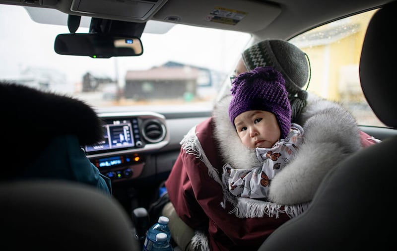 Maria Noolook and her daughter Adelynn from Rankin Inlet are parked during a car visit with an early years visitor.