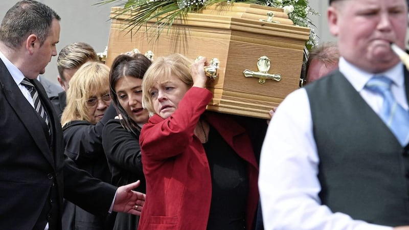&nbsp;<span style="font-family: Arial, sans-serif; ">Dean McIlwaine's family and frineds comfort each other at funeral in Carnmoney.&nbsp;Picture by Justin Kernoghan.</span>