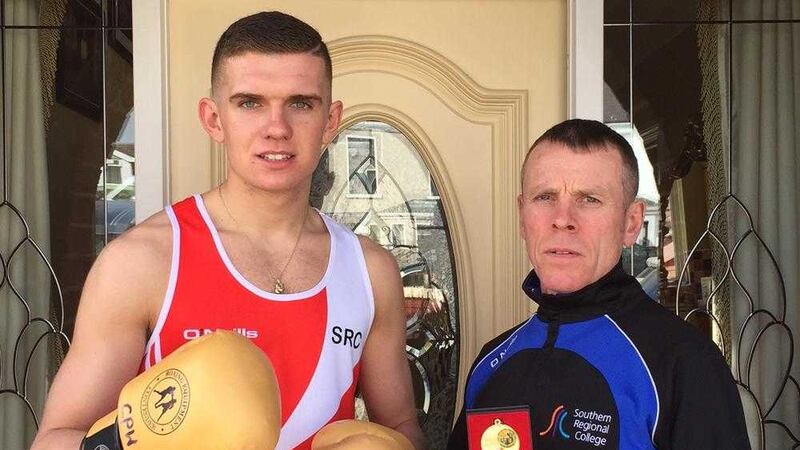 Conor Wallace with St Monica&#39;s, Newry coach Owen Murphy after winning the Irish Third Level title on Saturday 