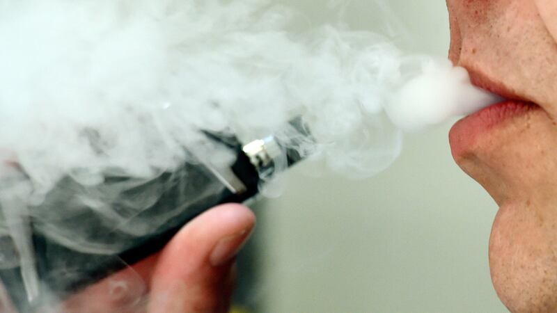 But scientists said more evidence is needed on the potential long-term harm of using e-cigarettes.