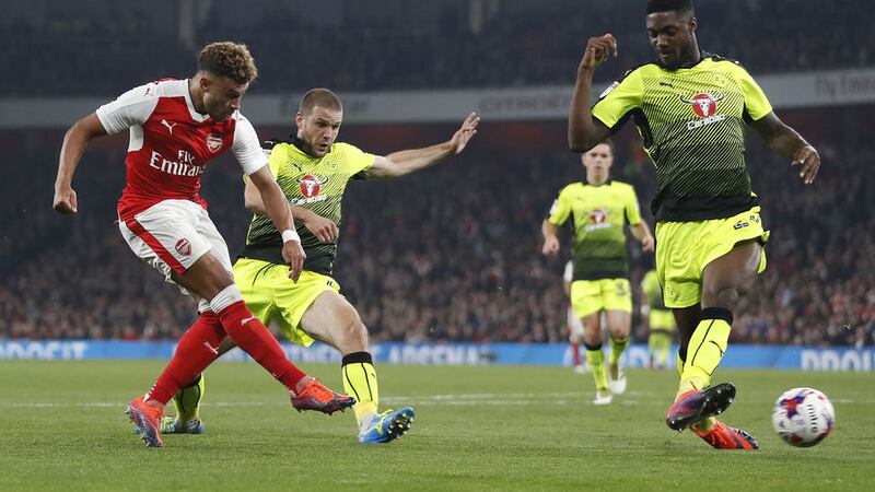 Arsenal's Alex Oxlade-Chamberlain scores in Tuesday night's EFL Cup victory over Reading at the Emirates stadium<br />Picture by PA