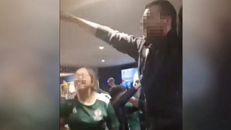 A still from the video in which people wearing Northern Ireland replica shirts are heard singing &#39;We hate Catholics&#39; 